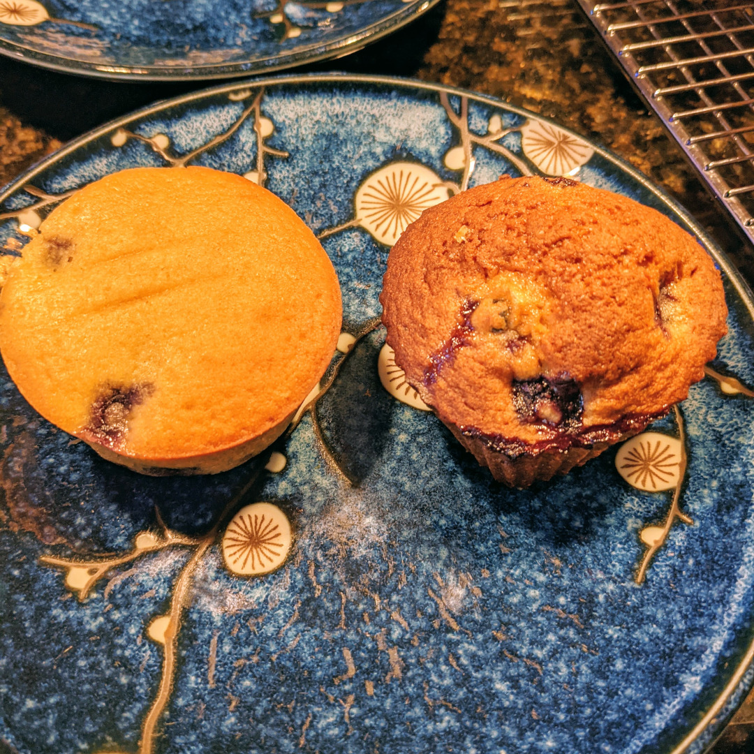 Two blueberry muffins, one clearly much better than the other