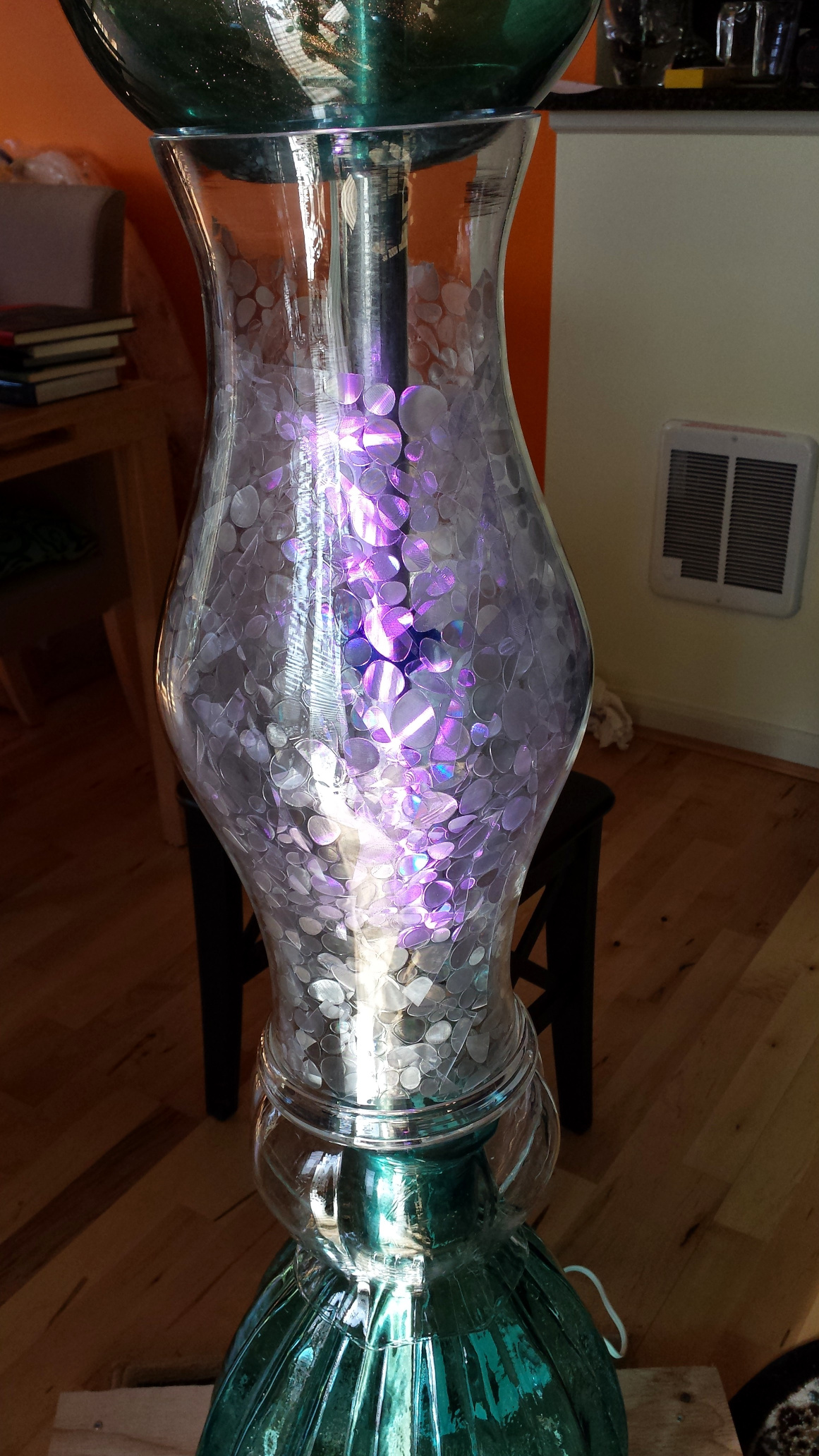The glass vase with surface treatment and lights inside.
