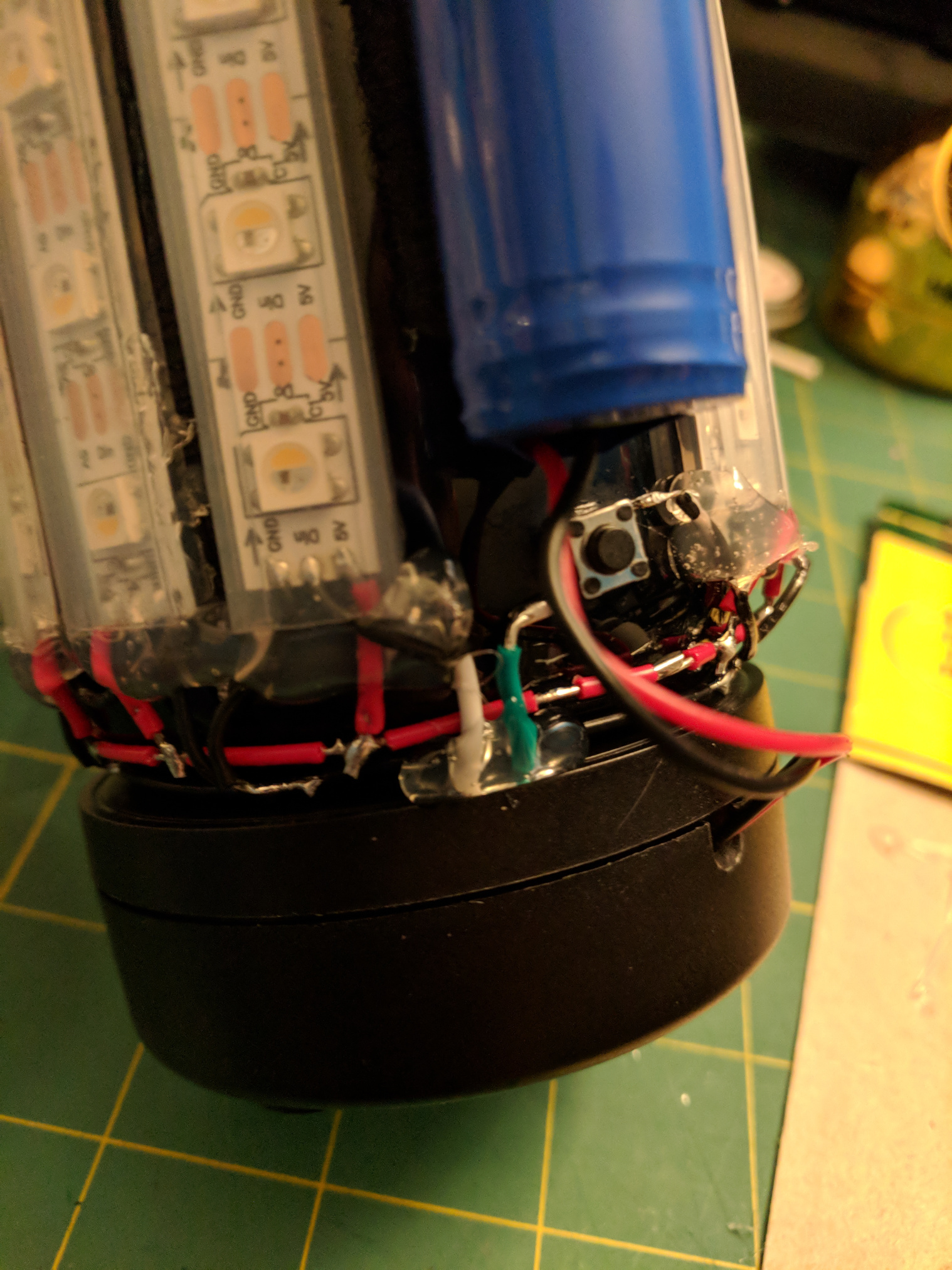 Close up of the bottom of the water bottle with the electonics enclosure mounted.